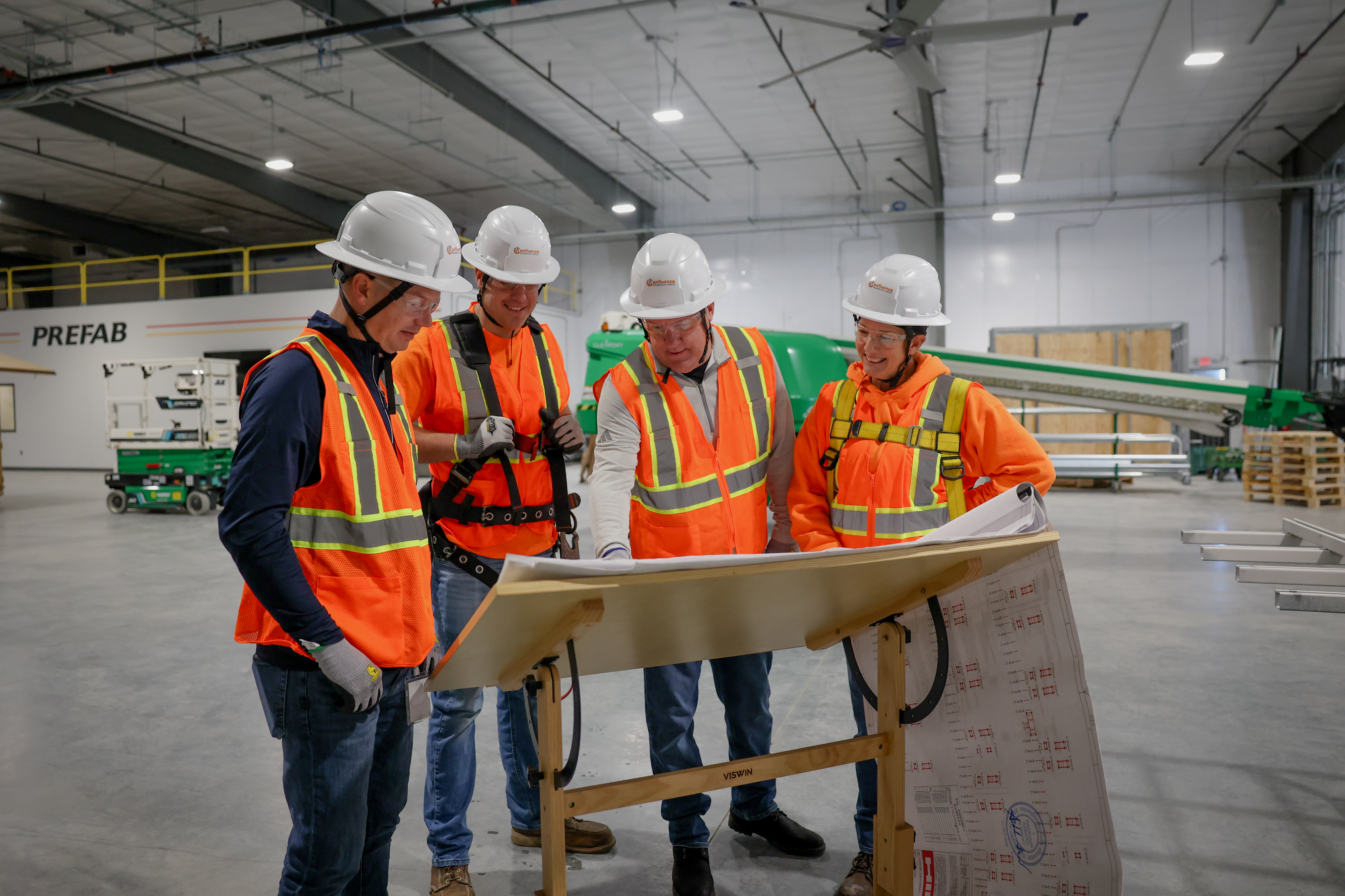 Confluence Workers around table